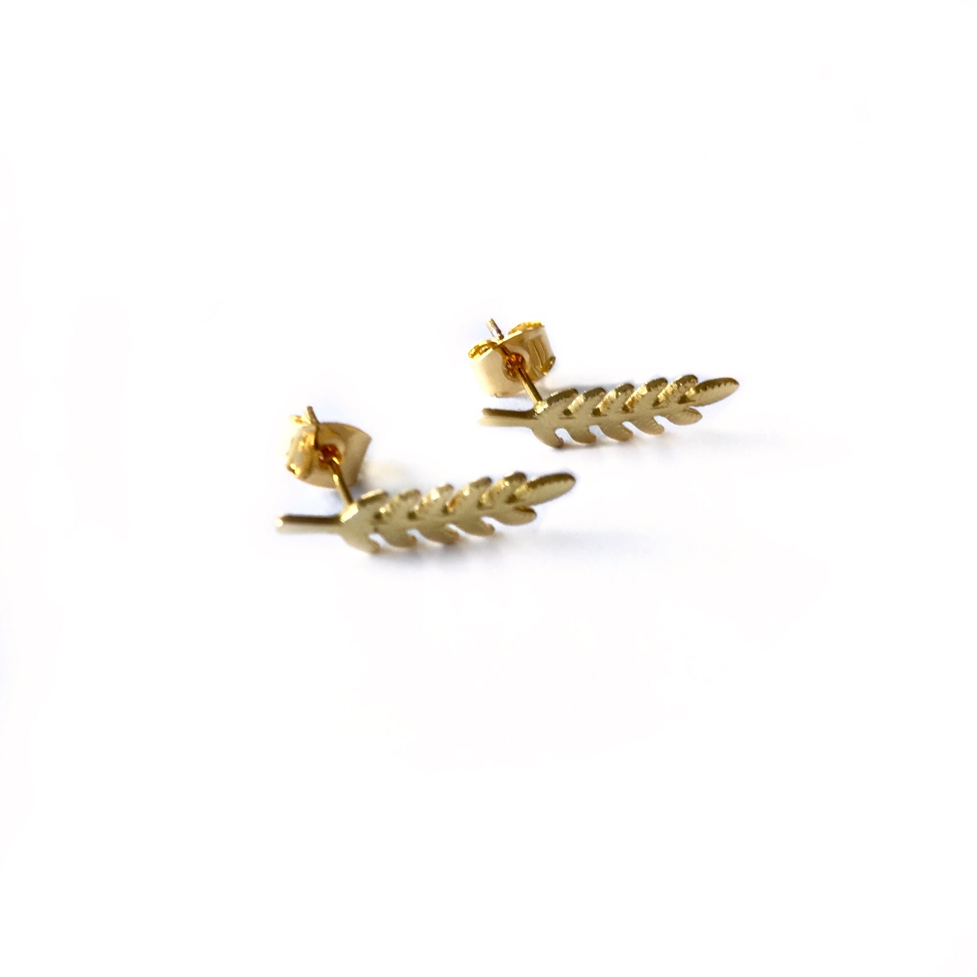 small and dainty gold plated leaf shaped stud earrings 