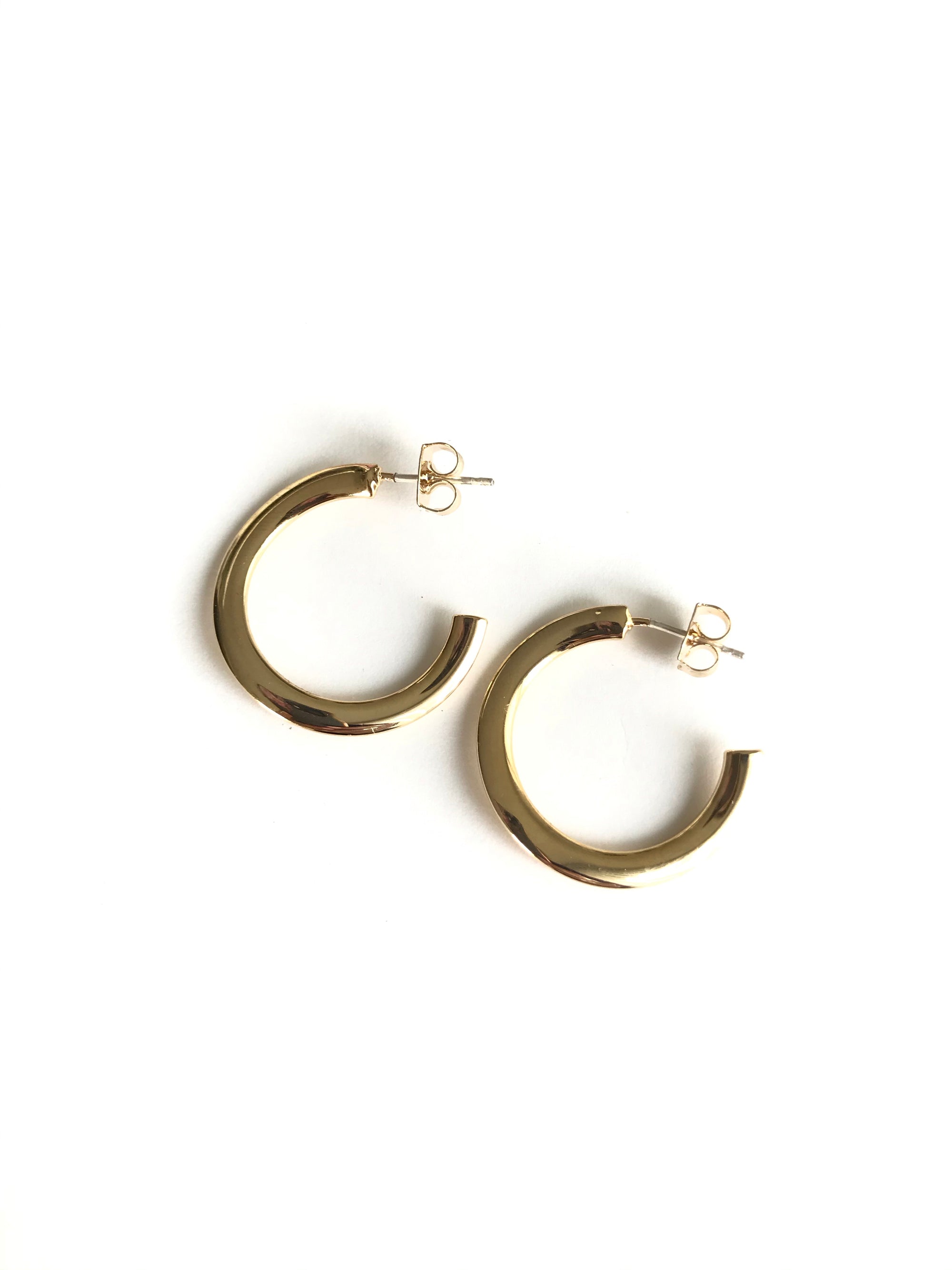 medium timeless semi hoop earrings with a sleek gold finish