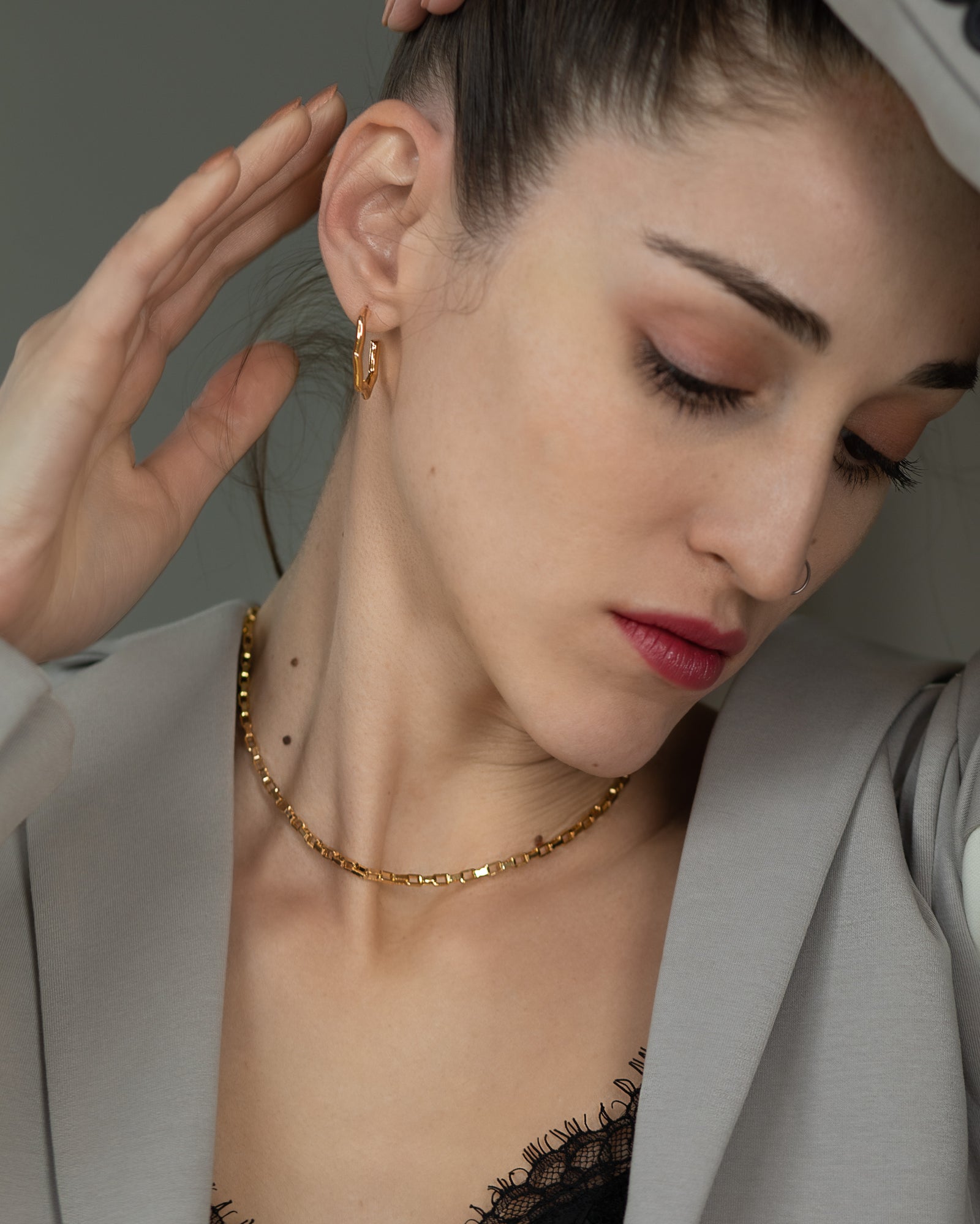 small gold plated half hoop earrings in an octagonal geometric shape  