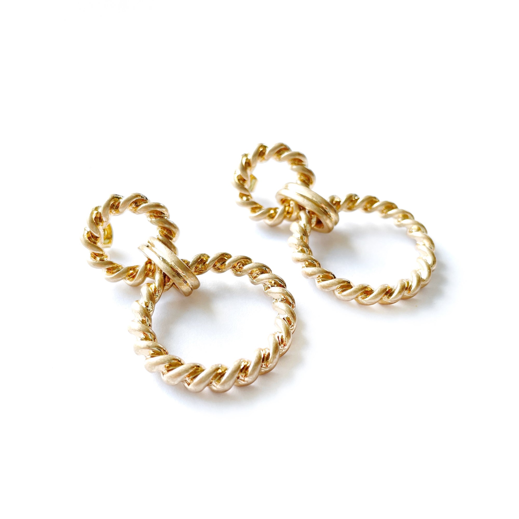 opulent gold linked hoop earrings with a twisted rope design 