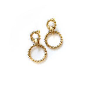 opulent gold linked hoop earrings with a twisted rope design 
