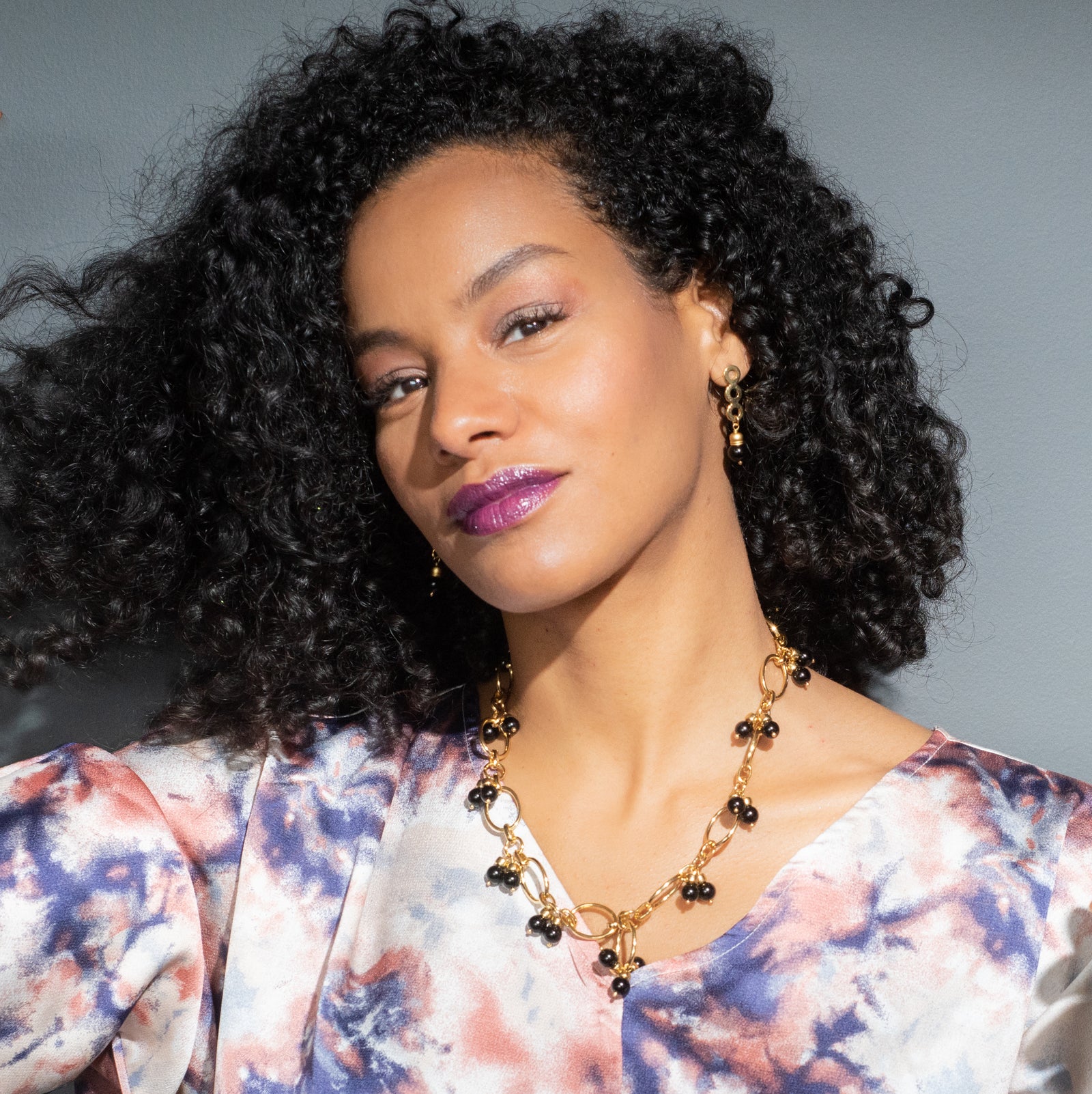 Black onyx gemstone drop earrings with a 2 inch drop chain and a matching medium sized open necklace with 24K gold plated pendant and large toggle clasp