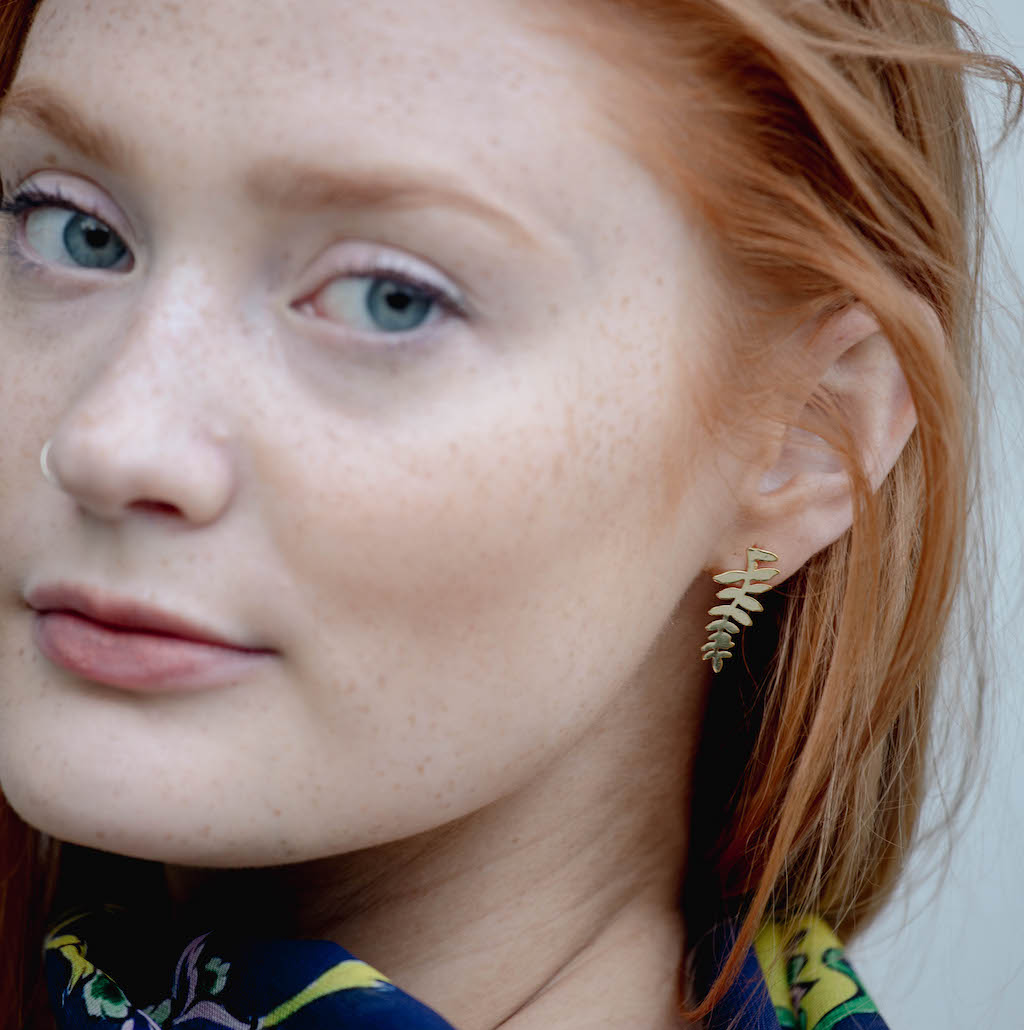 elegant medium sized gold plated earrings with a leaf design 