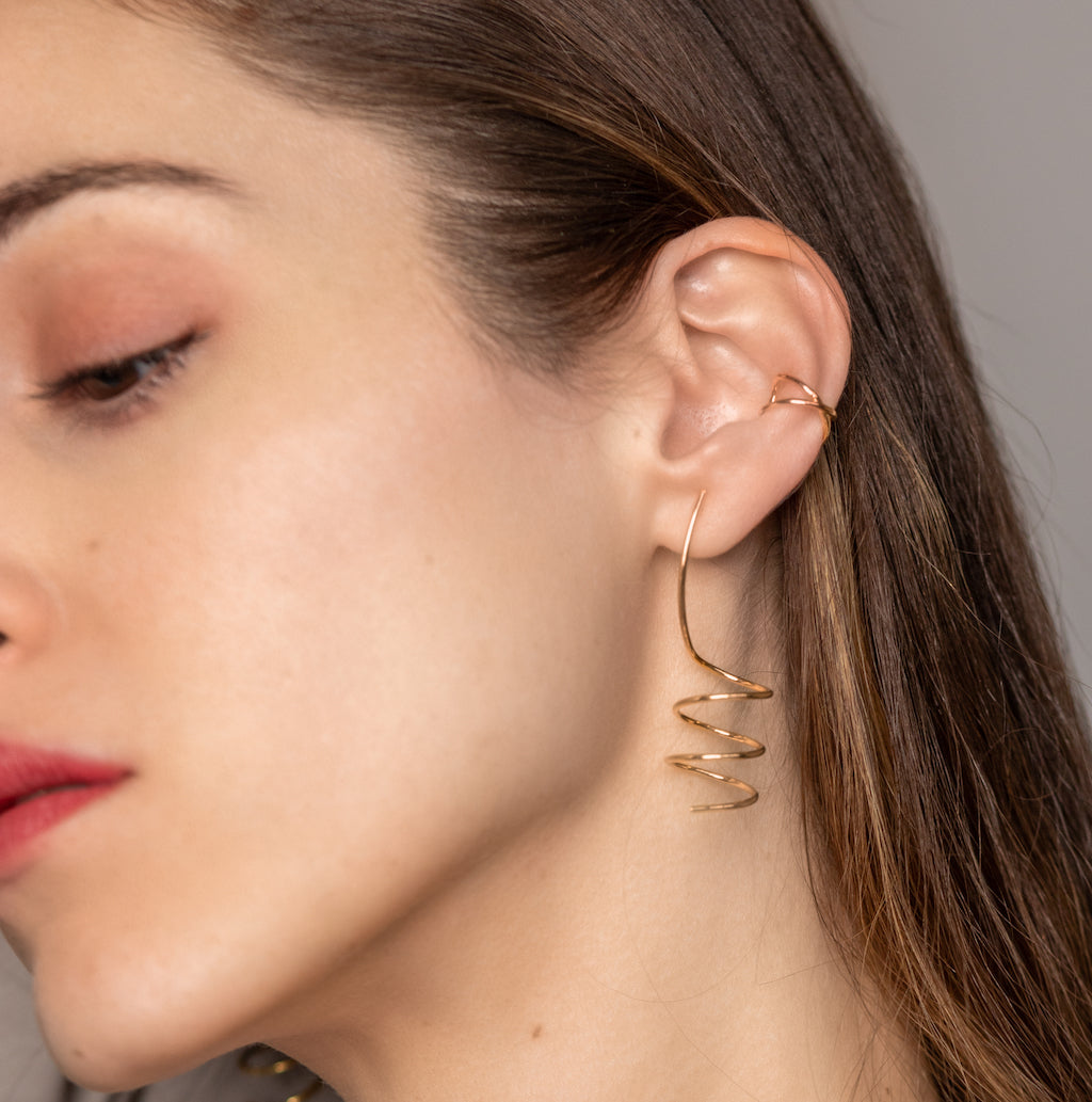 minimalist and dainty 2 inch drop spiral earrings in a gold plated finish