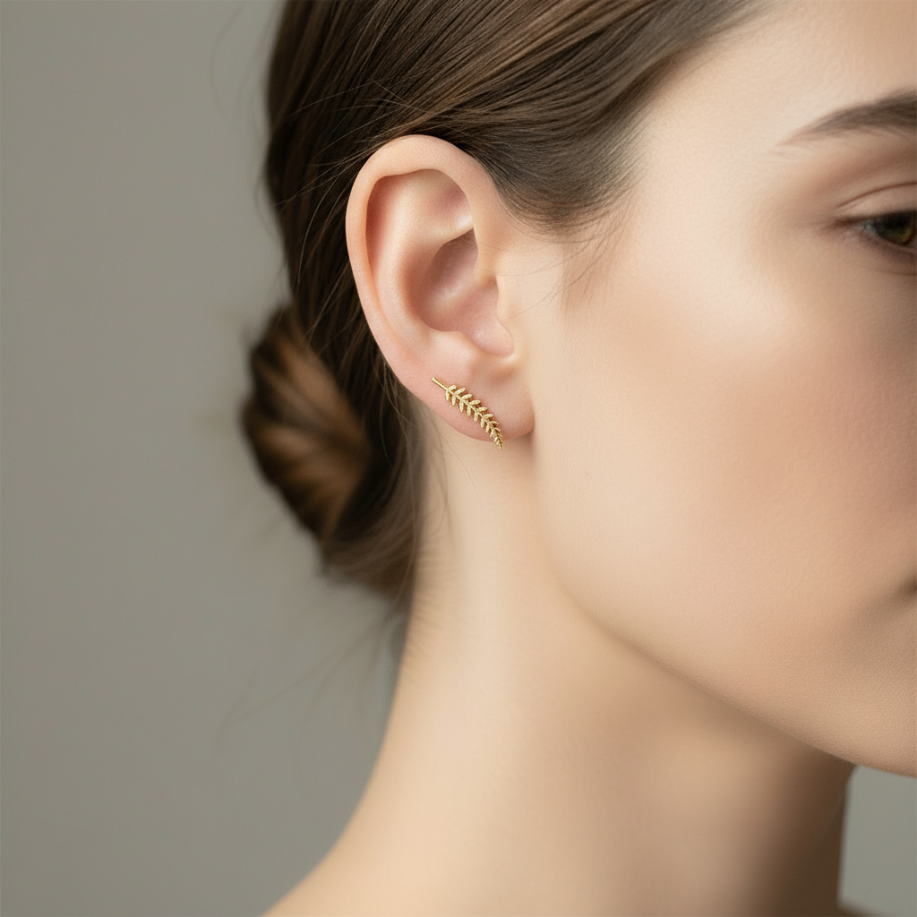 small and dainty gold plated leaf shaped stud earrings 