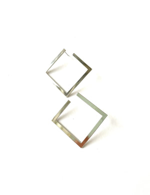 medium sized silver plated stud earrings in a square shape with a shiny finish