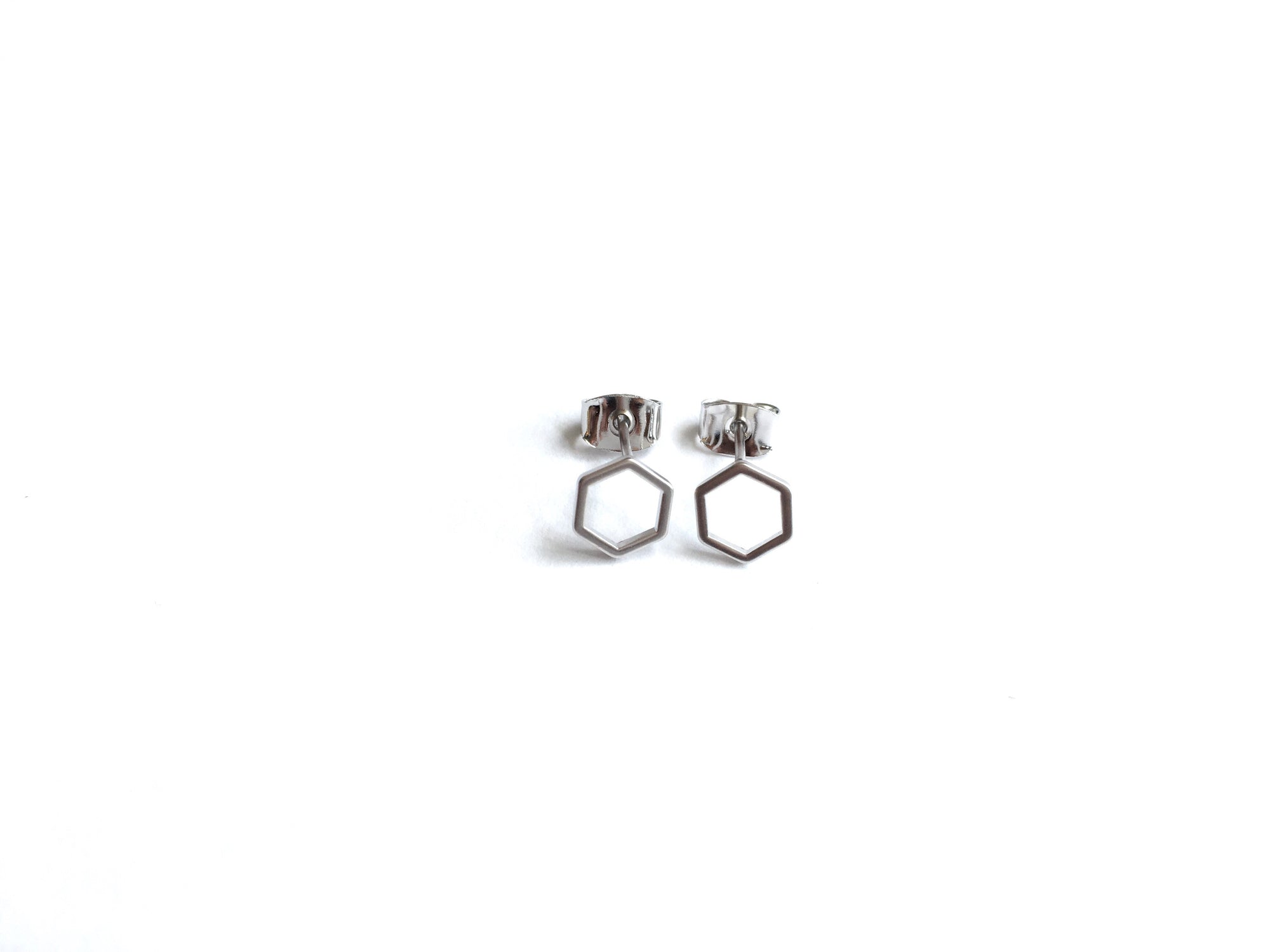 small open hexagon shaped stud earrings with a silver finish