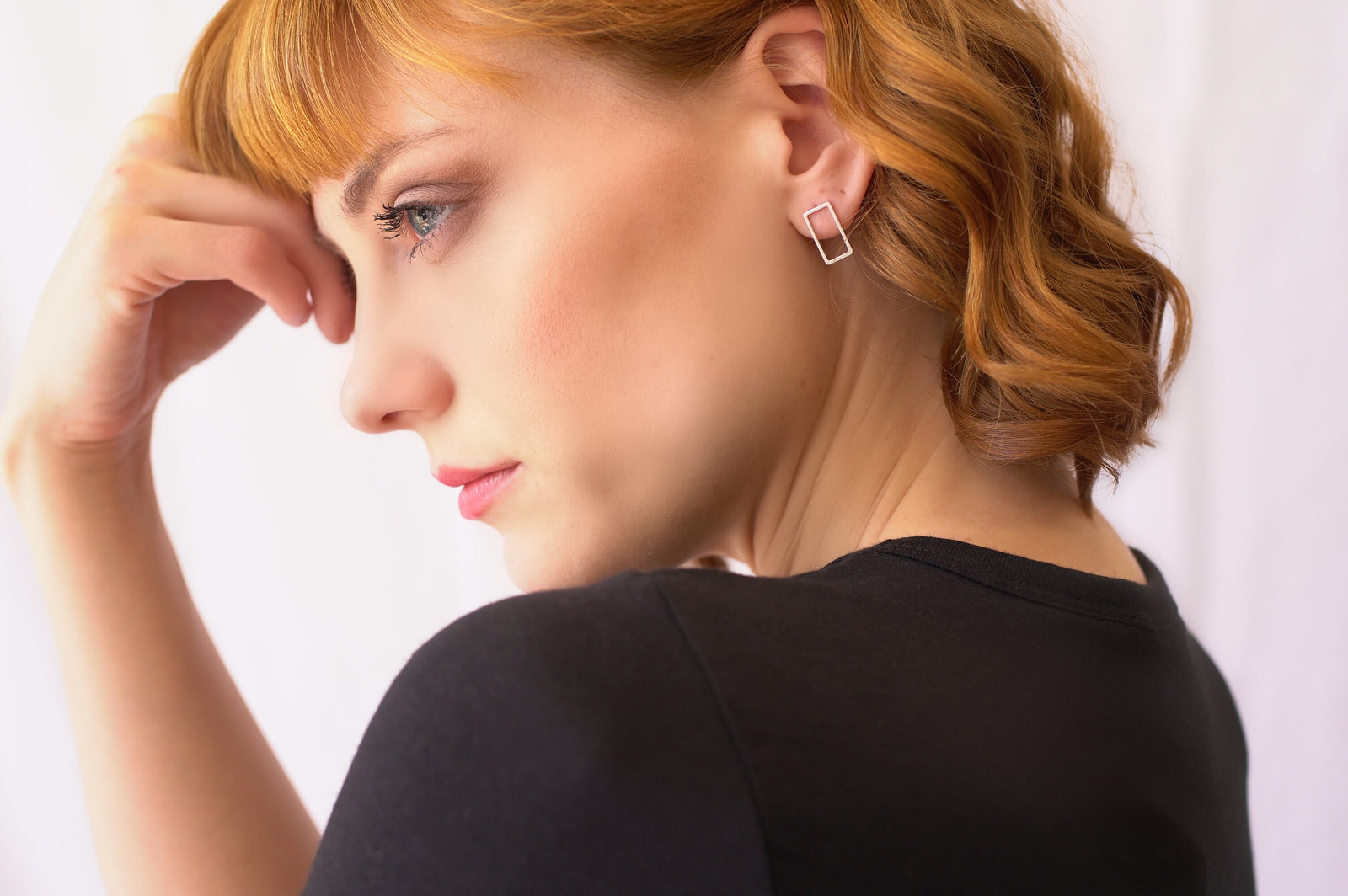 gold elegant statement piece with dainty open rectangle shaped stud earrings in a gold finish 