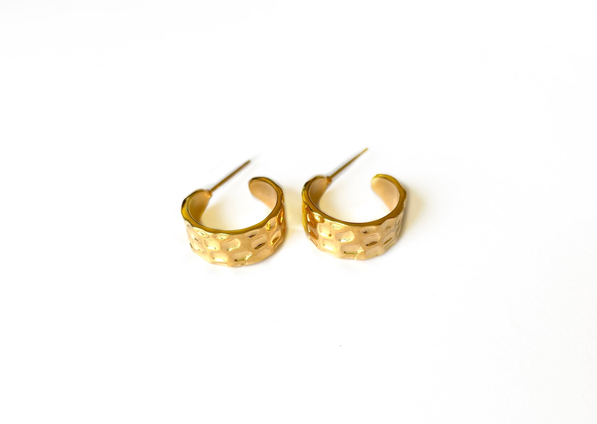 thick textured hoop earrings with a gold finish over italian brass 