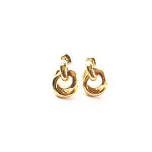 small thick hoop earrings with a twisted design in a shiny gold finish