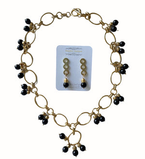 Black onyx gemstone drop earrings with a 2 inch drop chain and a matching medium sized open necklace with 24K gold plated pendant and large toggle clasp