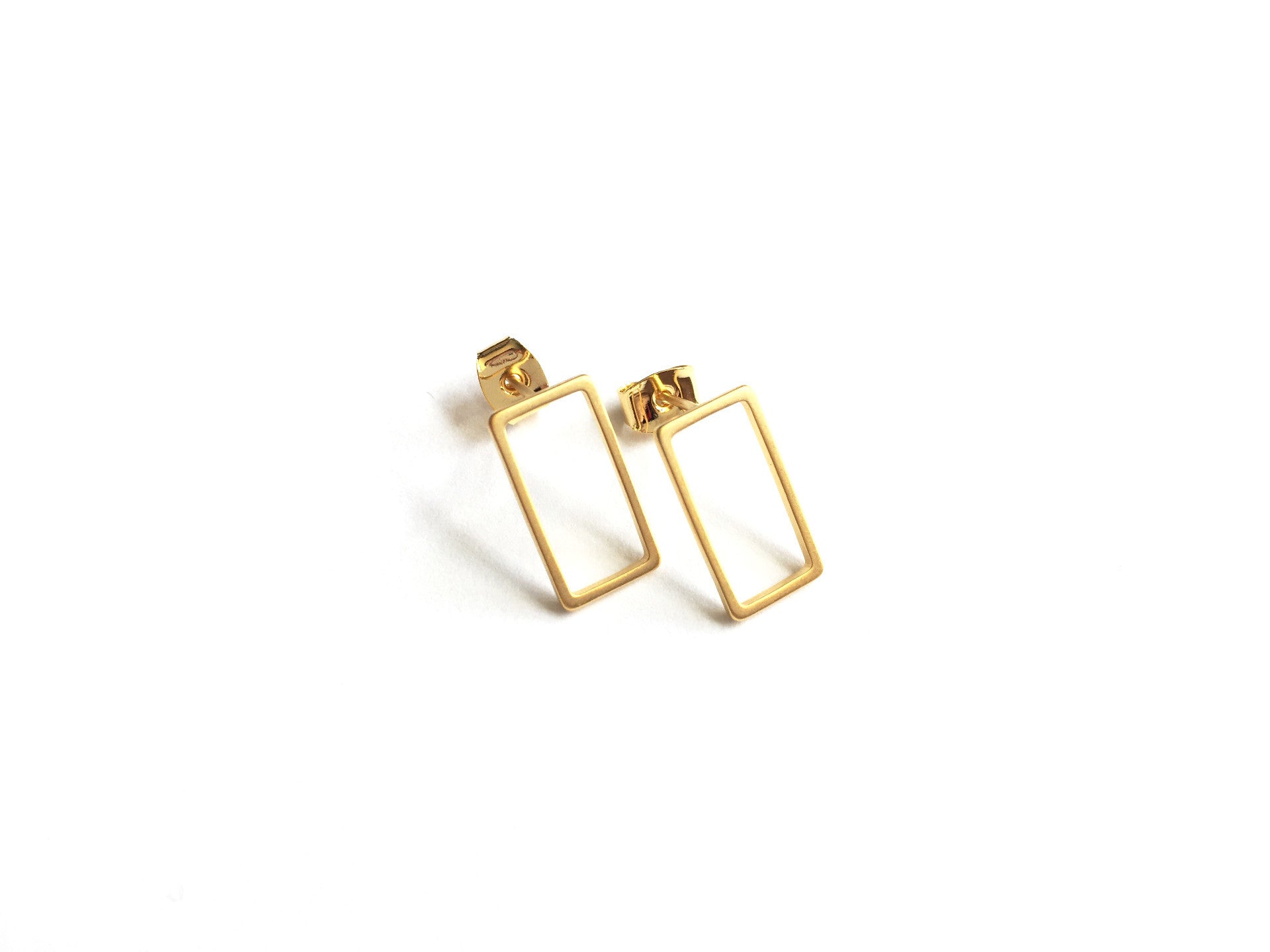 gold elegant statement piece with dainty open rectangle shaped stud earrings in a gold finish 