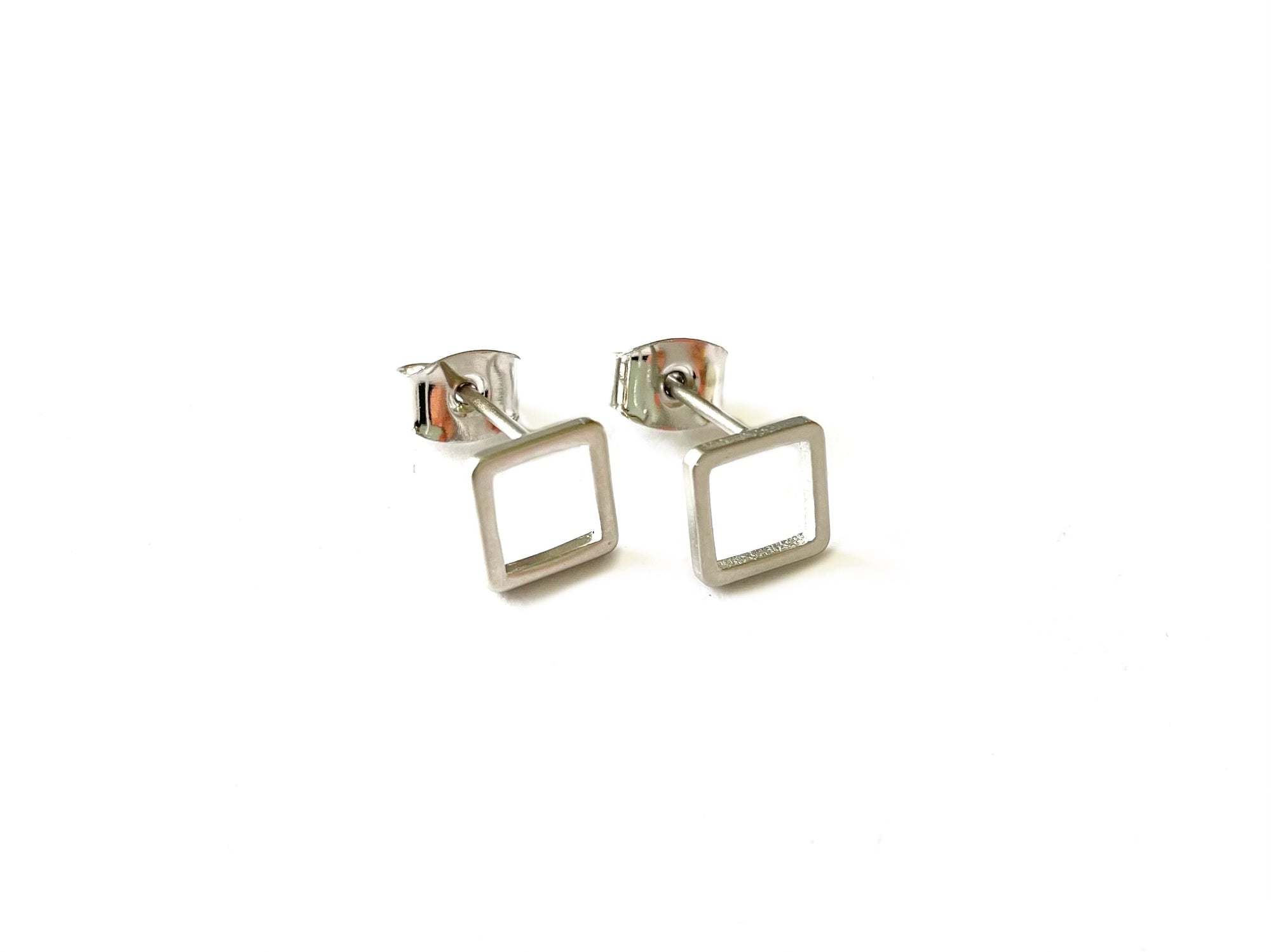 small open square shaped stud earrings statement piece with a silver finish