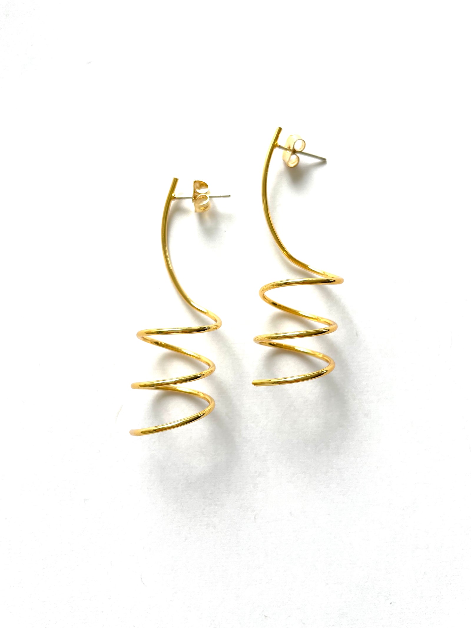 minimalist and dainty 2 inch drop spiral earrings in a gold plated finish