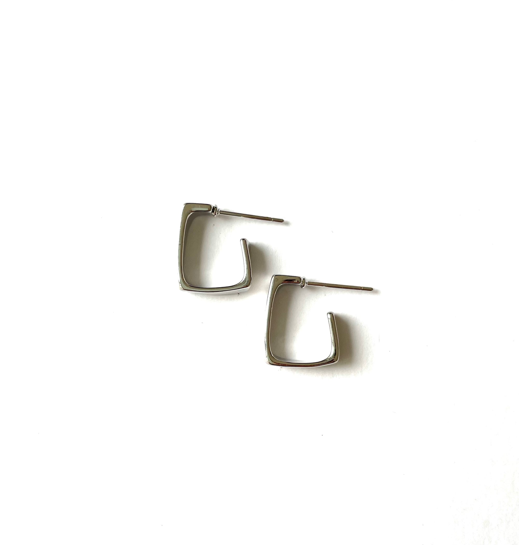 sophisticated small and dainty half open square shaped hoop earrings in a silver finish over italian brass